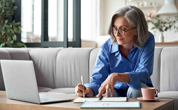 Woman writing on papers